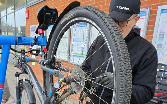 Dr Bike checking a bike at Wokingham train station