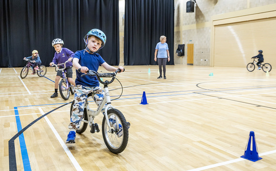 Learn to Ride sessions teaching children how to ride a bike