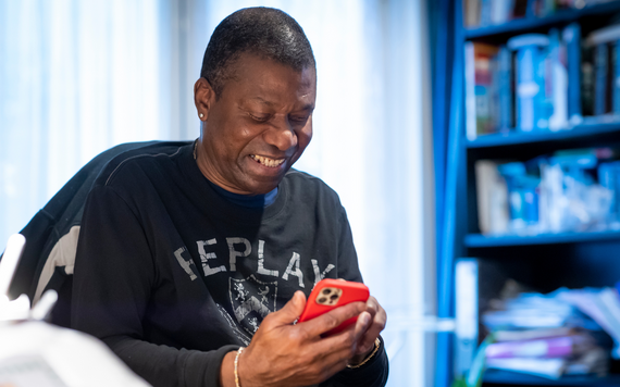 Image of man looking at his phone