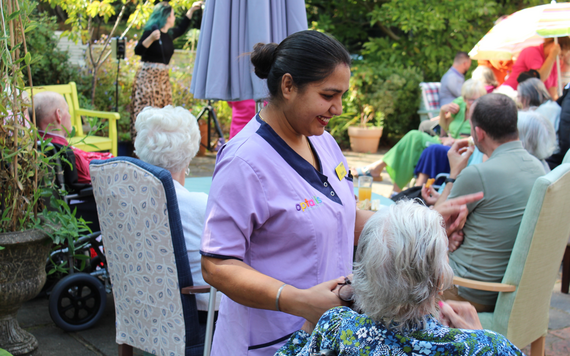 Image of the garden with residents at Bluebell House