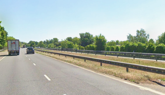 driver's eye view of a dual carriageway, looking towards the central barriers