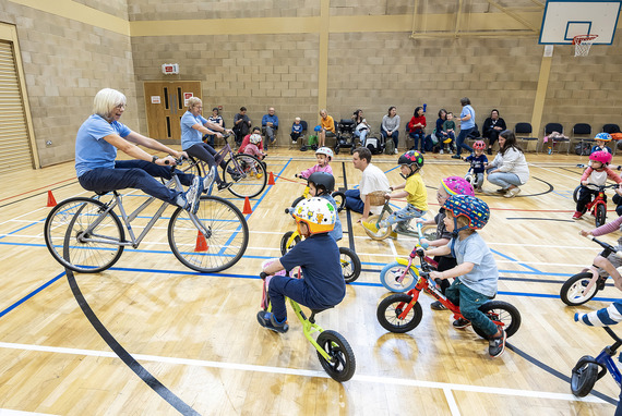 Instructor and a group of children at Balance Bike Club