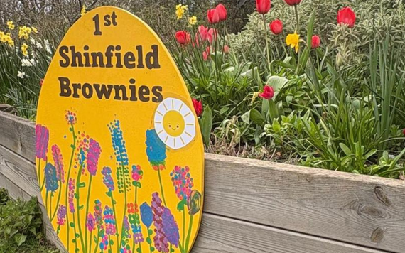 A large yellow Easter Egg which says 1st Shinfield Brownies