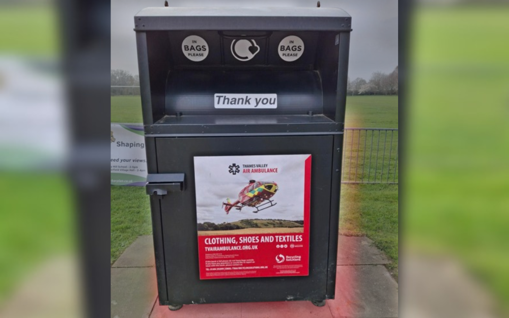 A clothes recycling bank in a neighbourhood setting.