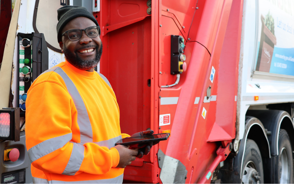 Man using tablet while working on waste collections