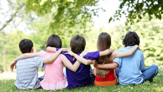 View of group of children from the back