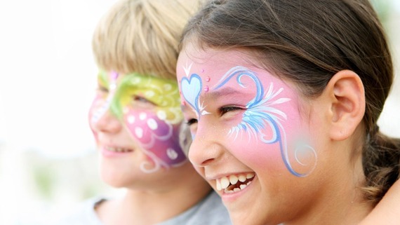 image of two children with their faces painted