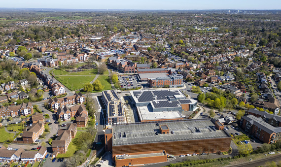 Aerial view of Wokingham town centre showing Carnival Hub with solar panels, Elms Field green space and surrounding streets