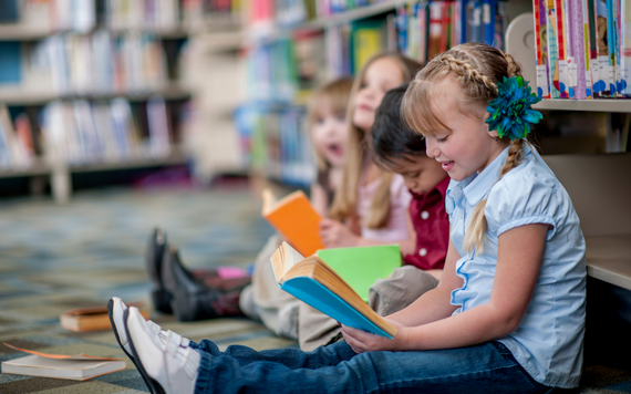 Children reading in a library