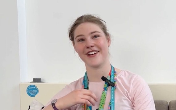 A young person at Reading College smiling