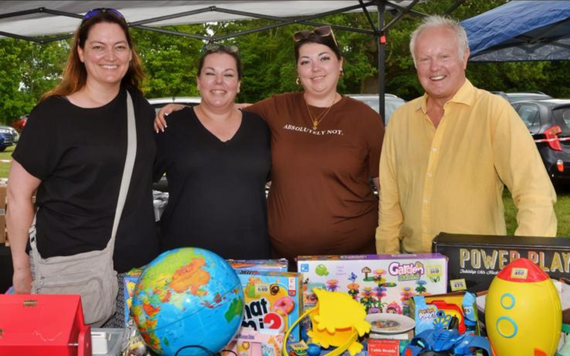Vickie with volunteers of Kaleidoscopic UK at a market stall