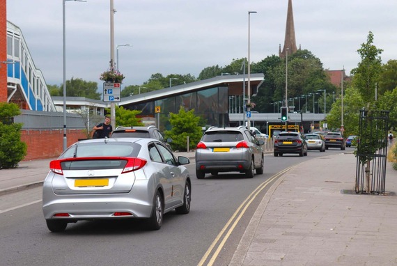 a line of cars approaching Wokingham station along the new Station Approach access road