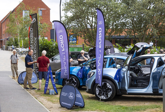 Residents look at electric vehicles during the rEVolution event on Elms Field in Wokingham.
