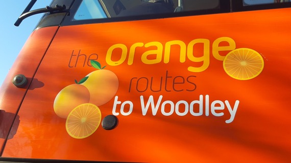 close up of the Orange routes logo on the side of a bus in Woodley