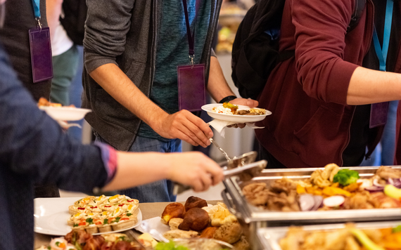 People getting food from a buffet
