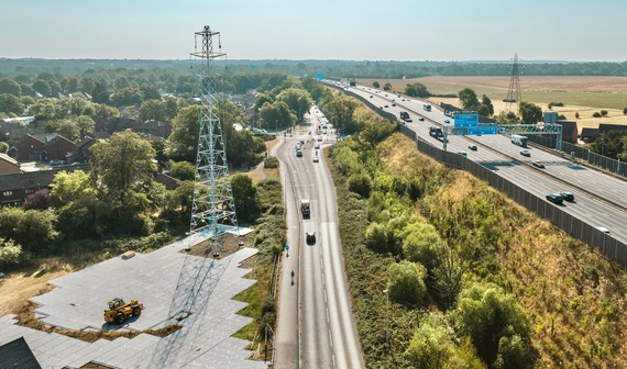 a newly rebuilt pylon looms over the M4 at Winnersh with no wires attached, and Hatch Farm Way running alongside