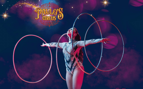 Lady with two hula hoops around both of her arms - Paulo's Circus