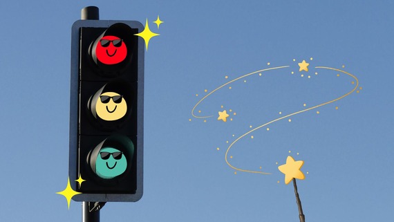 traffic lights with smiley faces over each light and a magic wand casting sparkles over them
