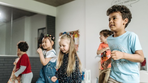 image of children dancing together