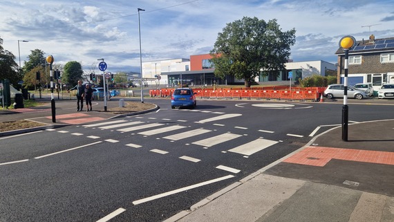 a new zebra crossing at a residential road junction in Woodley, with 20mph roundel painted on the tarmac