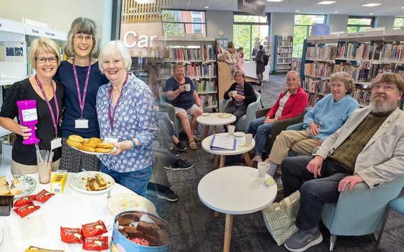 Cosy Coffee Morning, a picture of attendees and volunteers with tea and cake