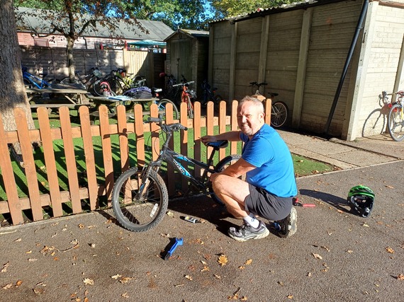 Dr Bike at the Hawthorns Primary School carrying out maintenance repairs to children's bikes