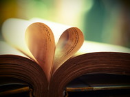 Book pages form the shape of a heart