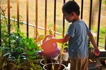 Child with watering can