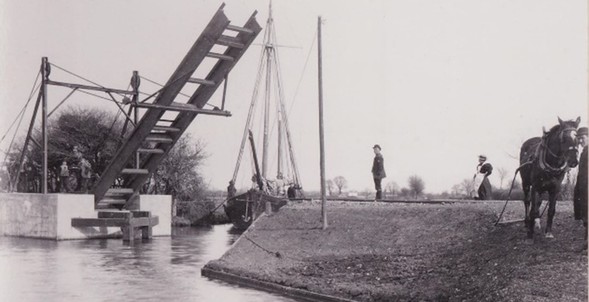 Chichester canal bridge with boat about to pass through