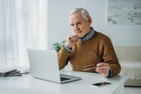 older man on laptop