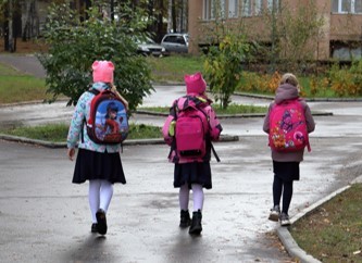 Three children walking to school