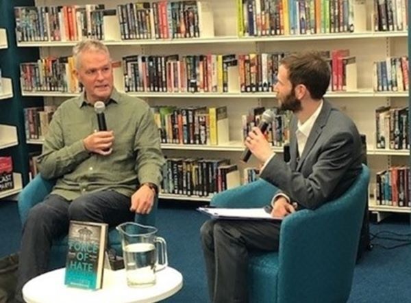 A man interviewing the author Graham Bartlett