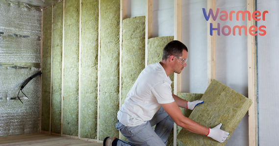 Man installing interior insulation