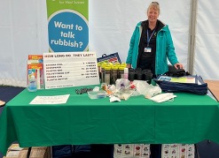 Image of a women in front of an events table