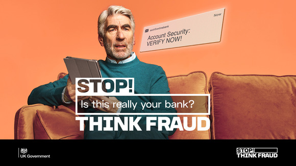 Man holding an iPad with a scared face. Text reads: Account security: Verify now. Stop! Is this really your bank? Think fraud. UK Government logo