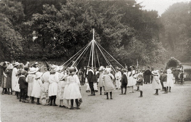 Children dancing around a Maypole