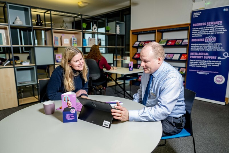 Two people talking about business at Crawley Library