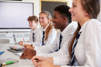 Secondary students sitting in a lesson
