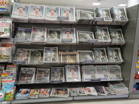 PH 32405 Photograph of newspapers marking the death of Queen Elizabeth II, 2023.