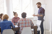 Staff discussing around a table