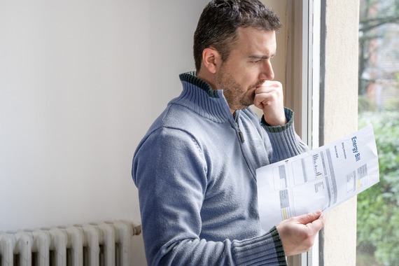 Man looking at energy bill looking worried