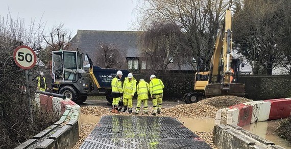 Contractors on site at Sack Lane in Bersted installing a temporary ramp over floodwaters.