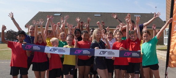 Children celebrating playground upgrades