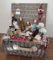 Wicker hamper with Christmas gifts in.