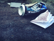 cans and paper in the gutter