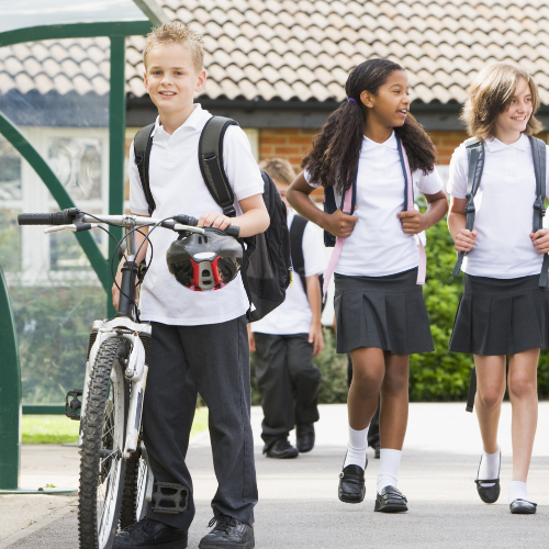A child pushing a bike