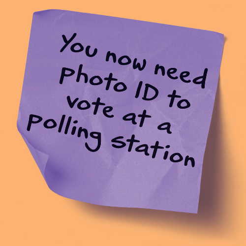 A purple sticky note with text that says you now need photo ID to vote at a polling station
