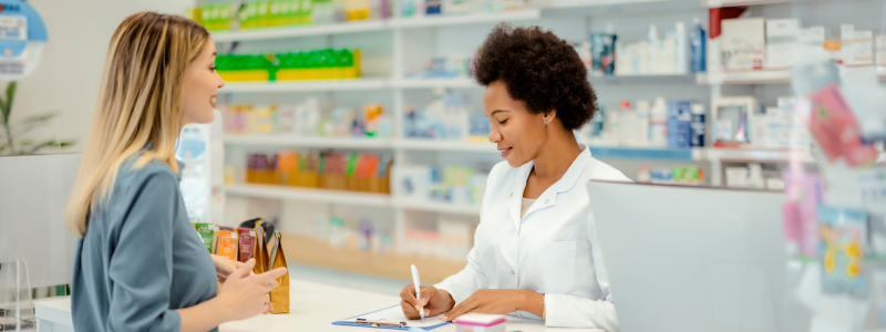 woman talking to pharmacist