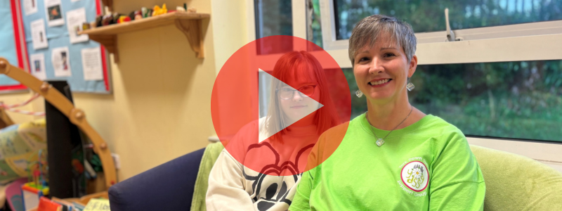 Darcey and Jo with a play sign for video