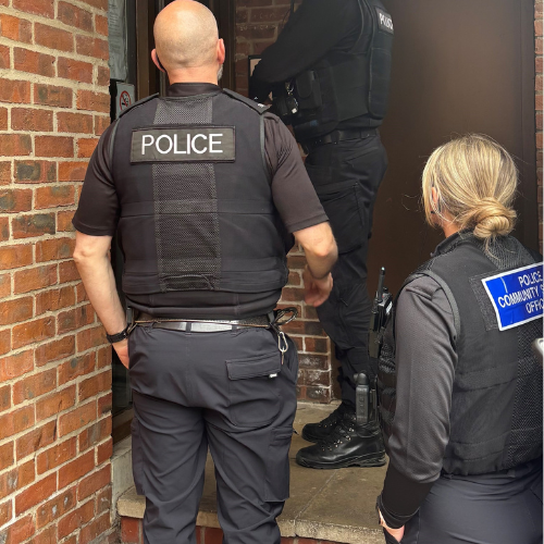 Police officers at a door